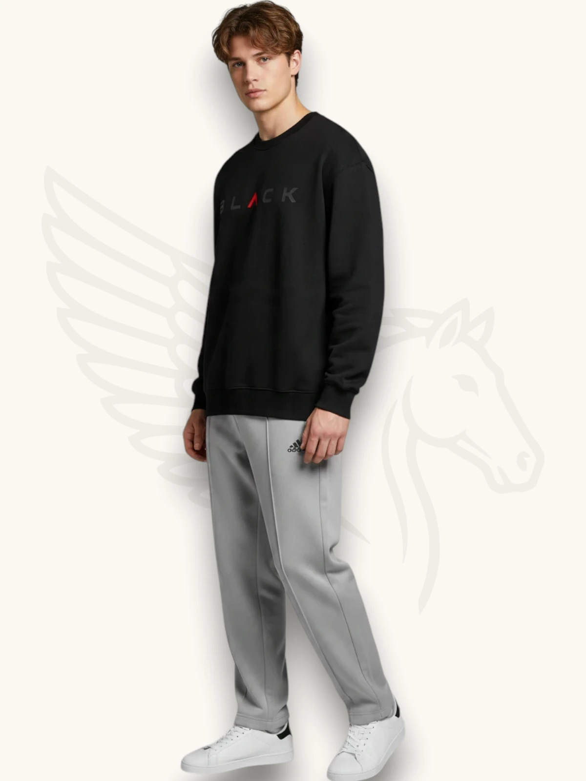 Black sweatshirt and light gray trouser tracksuit set on a male model, side view