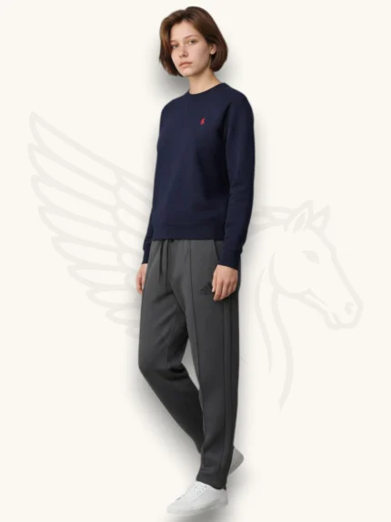 Navy blue sweatshirt and charcoal gray trouser tracksuit set on a female model, side view