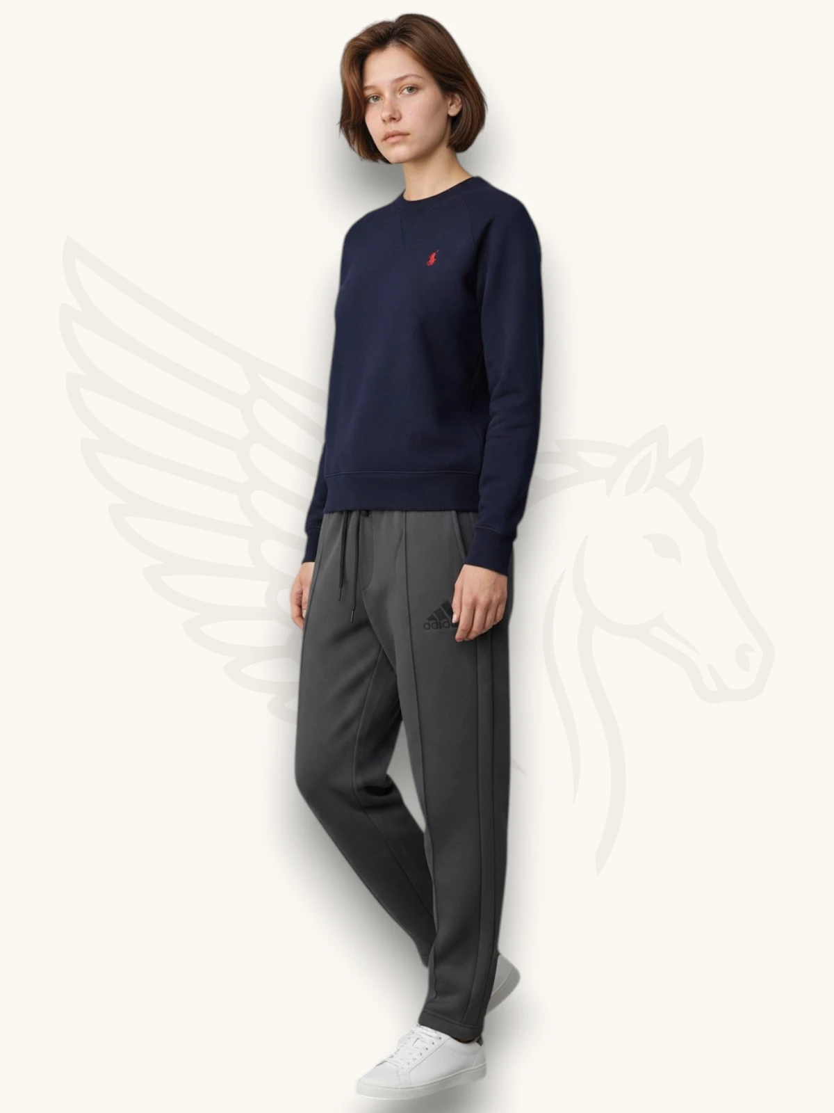 Navy blue sweatshirt and charcoal gray trouser tracksuit set on a female model, side view