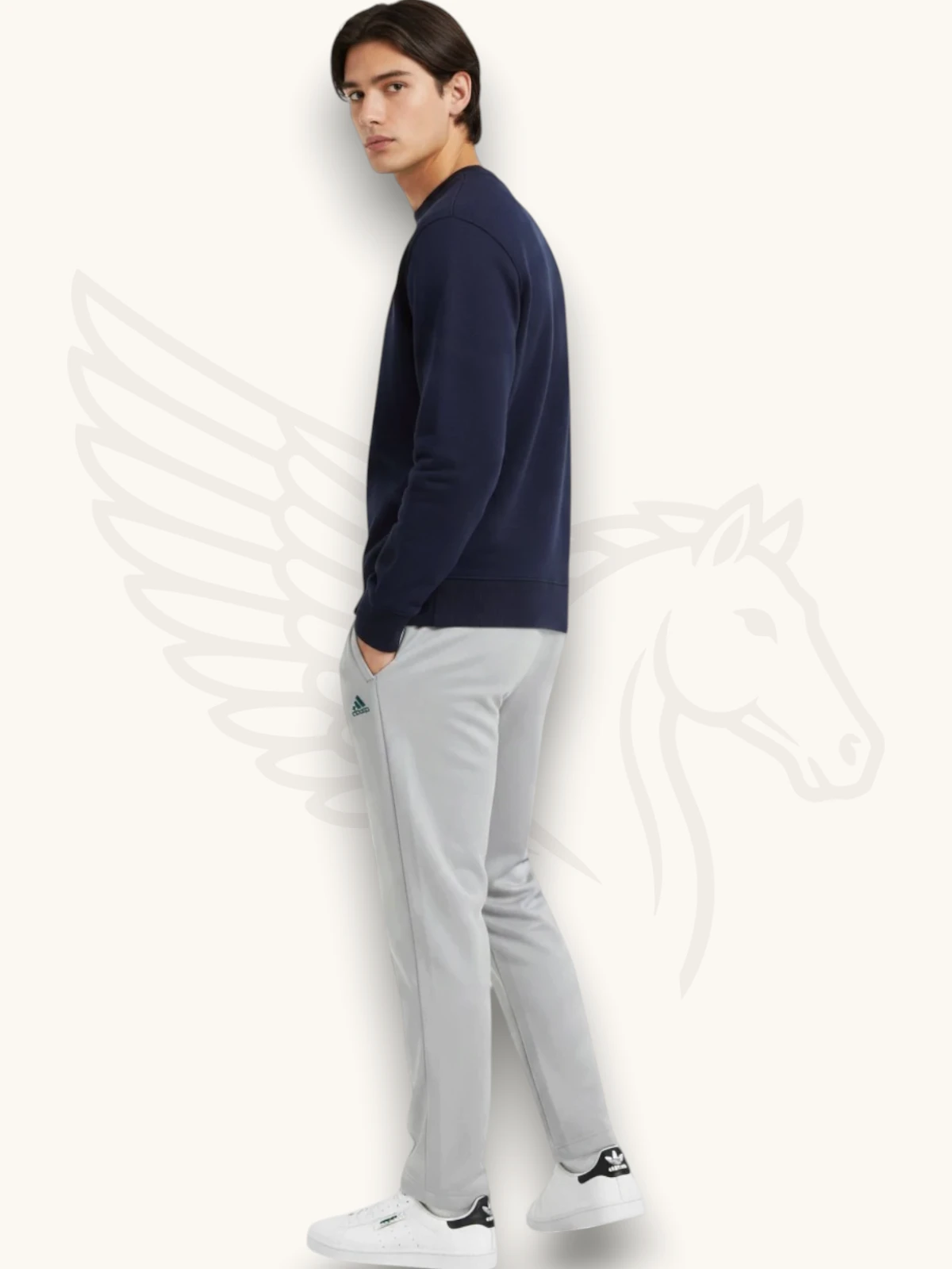 Navy blue sweatshirt and light gray trouser tracksuit set on a male model, side view